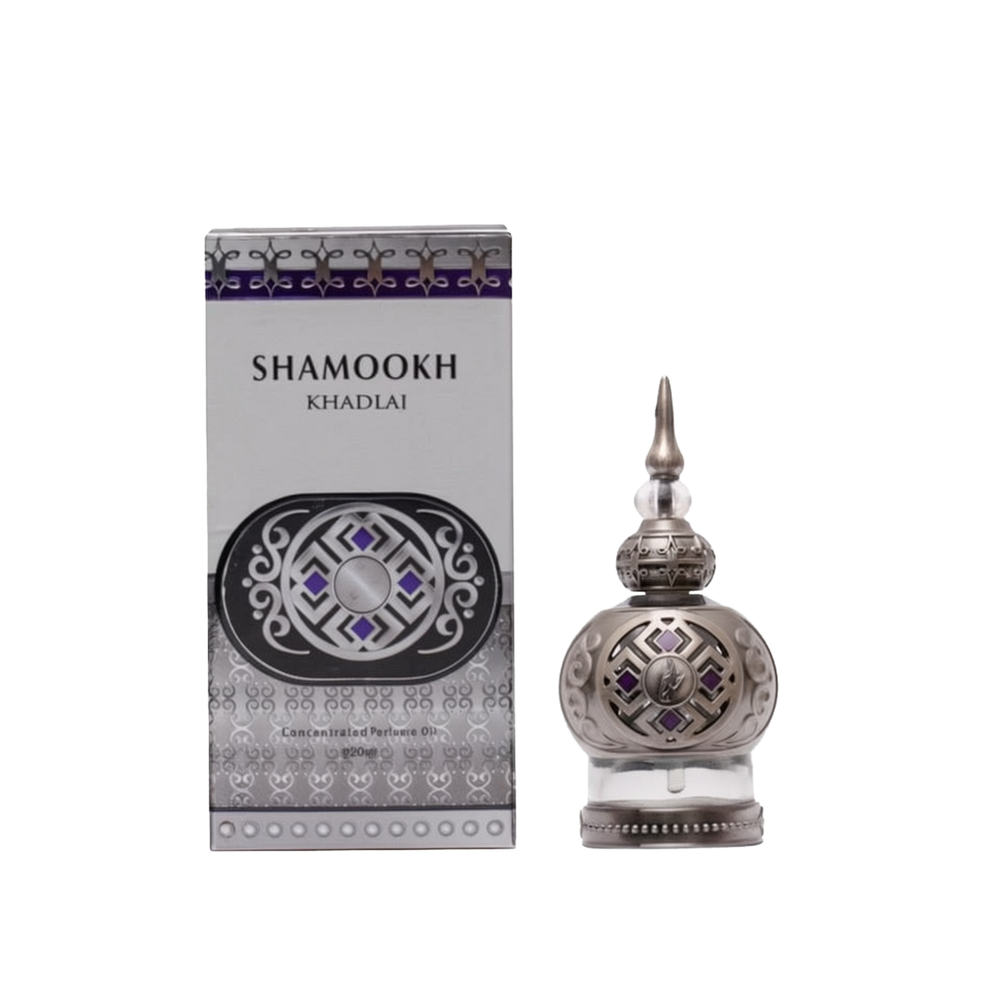 The image shows a product called "Shamookh" by Khadlaj, which is a concentrated perfume oil. The perfume comes in a 20ml spherical bottle with a silver finish, featuring intricate patterns and a pointed cap that adds a touch of elegance. The design includes decorative elements with purple accents, enhancing its luxurious appearance. The packaging box matches the bottle's design, with a silver and purple theme, featuring the product name "Shamookh" in bold letters and additional ornamental details.