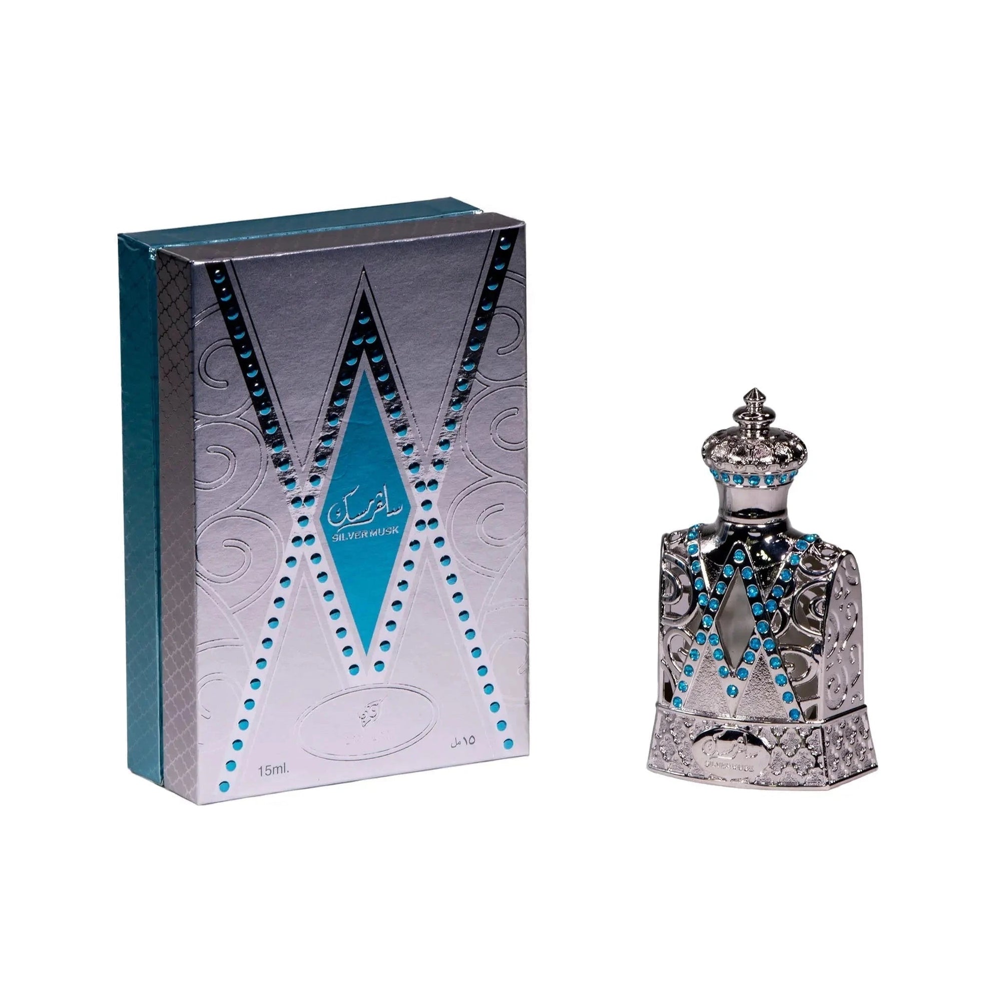 The image displays a perfume bottle next to its packaging. The packaging is a tall rectangular box with a silver color scheme and features a pattern that mimics the design of the bottle, with a central V-shaped motif outlined in blue. The bottle itself is crafted with intricate silver detailing, resembling a piece of filigree work, and is adorned with bright blue gemstones arranged in two parallel V-shaped lines that accentuate the bottle's design. 