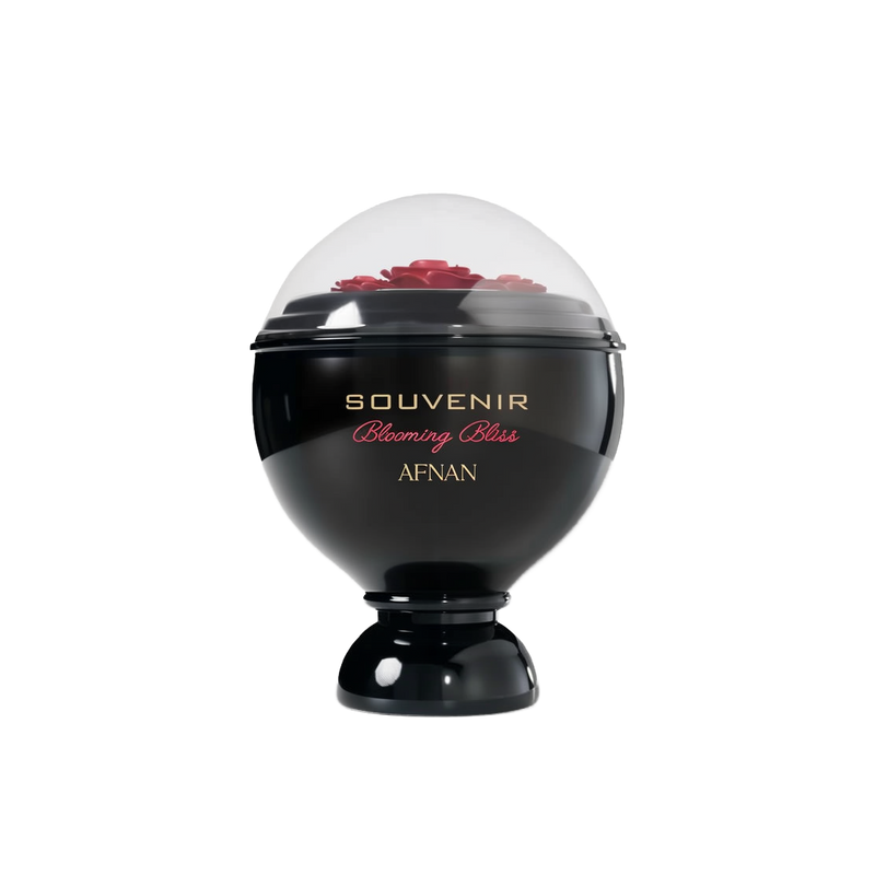 A glossy black, spherical perfume bottle labeled “Souvenir Blooming Bliss” by Afnan, topped with a transparent dome showcasing sculpted red roses underneath.