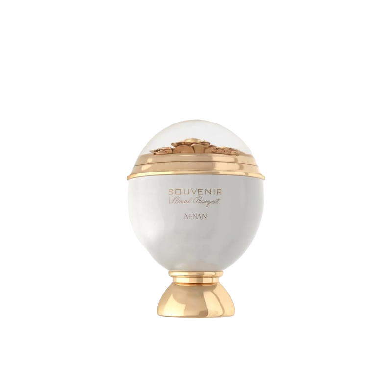 The image shows an elegant perfume bottle designed in the shape of an ornate sphere. The bottle is predominantly white with gold accents, including a gold base and a gold band around the middle. The top half of the bottle is transparent, showcasing intricate floral decorations inside. The label on the front reads "Souvenir Floral Bouquet by Afnan" in stylish, gold lettering.