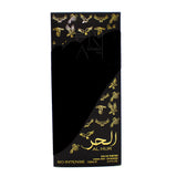 The image shows a perfume box for "AL HUR SO INTENSE" by Ard Al Zaafaran. The box is black with gold accents and features a diagonal cutaway design, revealing a portion of the black inner layer. Embellished with gold embossed doves in flight, it creates a sense of motion and luxury. There's a watermark stating "IMAGE PROPERTY OF AL-RASHAD LLC" across the top. The product details, including "EAU DE PARFUM NATURAL SPRAY" and the size "100mL 3.4FL.OZ", are clearly printed in gold lettering. 