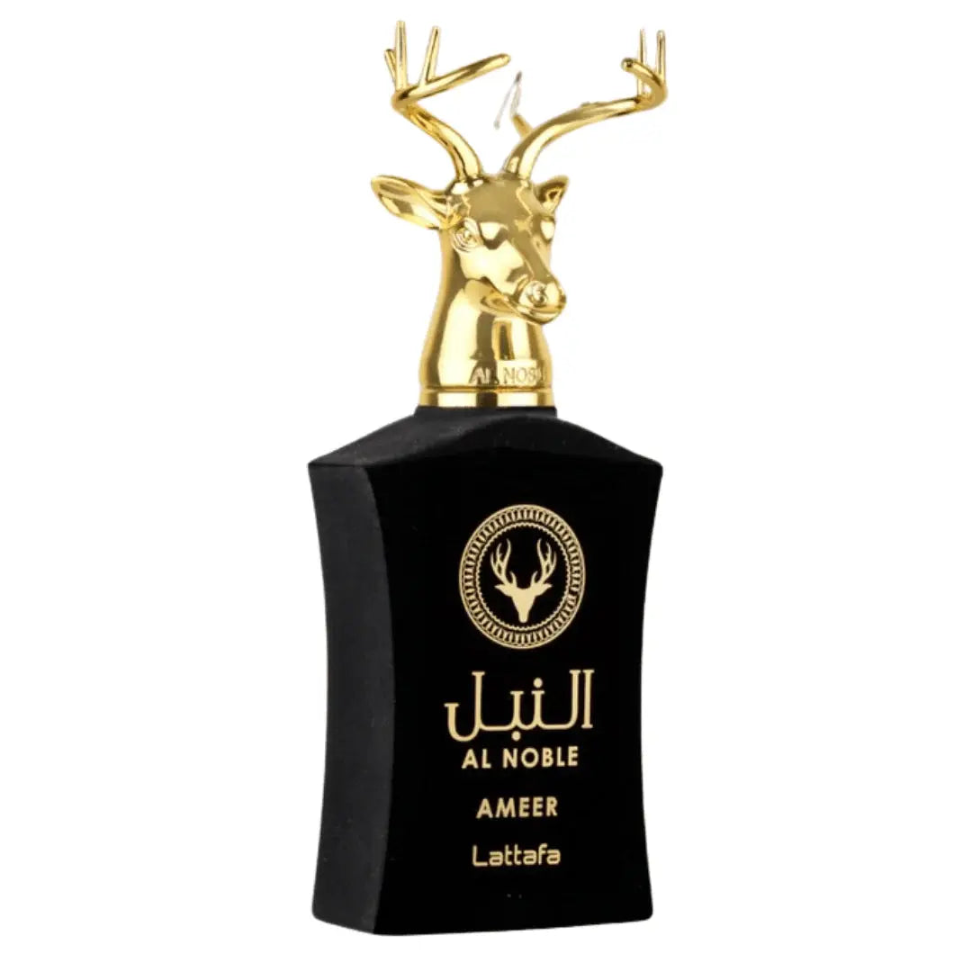 The image depicts a perfume bottle of "Al Noble AMEER" by Lattafa. The bottle is sleek and black with golden accents, including the brand name and logo in gold lettering. Topping the bottle is a distinctive, shiny gold cap designed to resemble a majestic deer head with branching antlers. The design elements suggest a luxurious and masculine fragrance. 