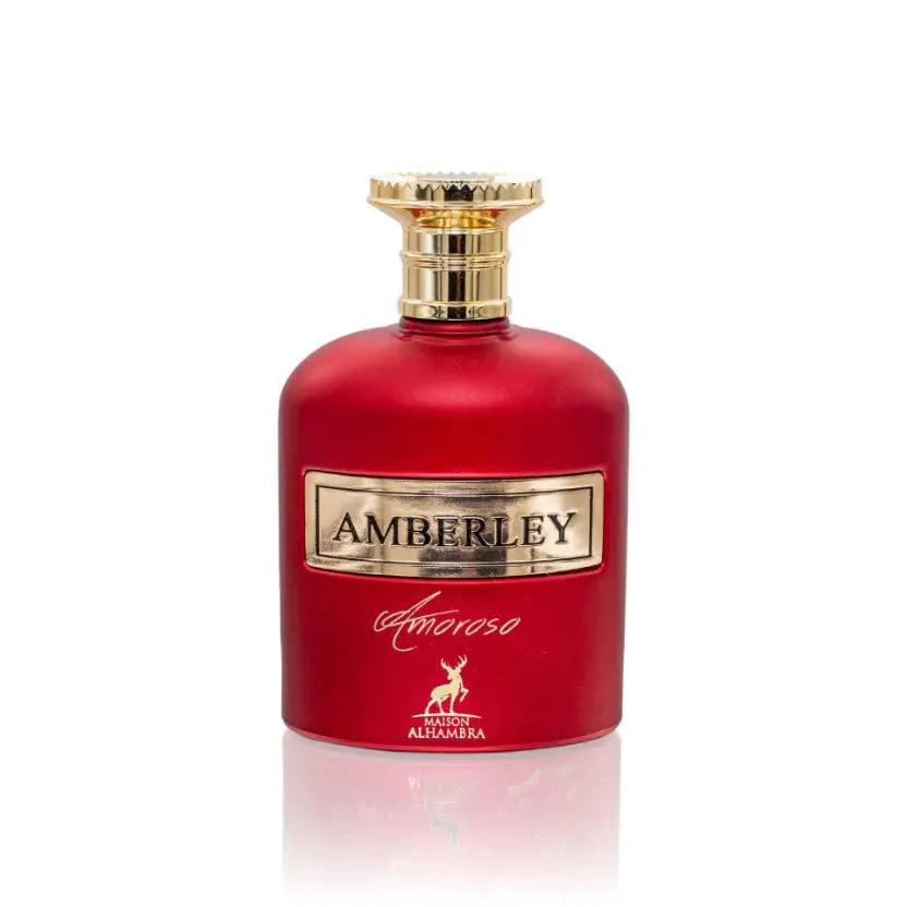 The image features a luxurious red perfume bottle with a golden cap. The front of the bottle has a gold label with the name "AMBERLEY" inscribed on it, and below is the word "amoroso" in cursive, along with a small gold emblem depicting a deer, indicating it may be the logo for "Maison Alhambra". The bottle's vibrant red color and golden accents suggest a rich and opulent fragrance. The background is a plain white, accentuating the bottle's bold colors.
