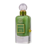 A perfume bottle labeled "Pistachio Musk" from the Ithra Dubai Musk Collection by Ard Al Zaafaran. The perfume liquid is a rich green color, and the bottle features a gold-threaded neck with a clear, spherical cap. A small, ornamental gold charm with green accents is attached to the neck by a green cord. The label is framed in gold with a green background, and the text is in both Arabic and English. The design suggests an elegant and luxurious fragrance product.