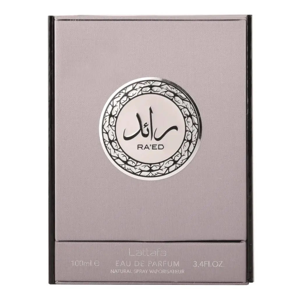 The image features a perfume box for "RA'ED Lattafa" perfume. The box is grey with a black border at the bottom and has a metallic sheen. On the front is a circular label with intricate black and white Arabic calligraphy in the center and an ornate border. Below the circular design, the text reads "100ml EAU DE PARFUM 3.4FL.OZ. NATURAL SPRAY VAPORISATEUR".