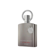 The image features a perfume bottle with a contemporary design named "SUPREMACY not only intense" by Afnan. The bottle has a matte silver-gray finish with a sturdy, rectangular shape and slightly rounded edges. The cap is a simple yet elegant silver ring that stands vertically on top of the bottle. An intricate emblem is embossed on the front, giving the bottle a luxurious and stylish appearance.