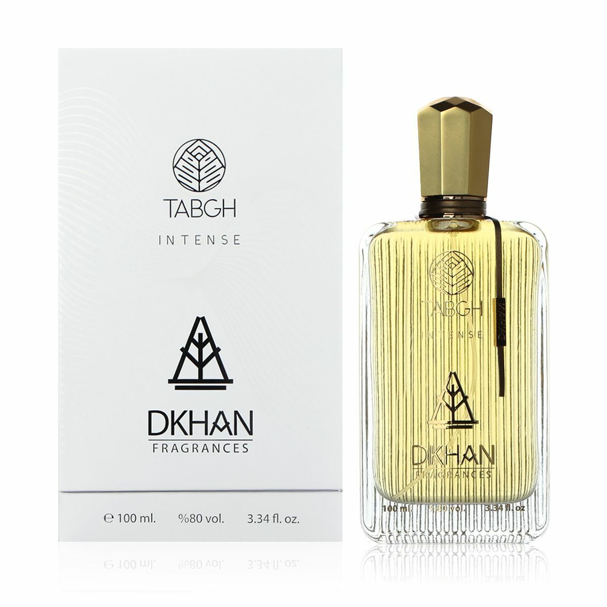 The image features an elegant, clear glass perfume bottle with vertical ridges and a golden-yellow fragrance inside, next to its white packaging box. The box and bottle both have the "TABGH INTENSE" branding and the "DKHAN FRAGRANCES" emblem prominently displayed. A geometric leaf-like logo is visible above the text on both items. The bottle has a gold-colored cap and a black vertical label on the right side.