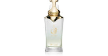 The image is of a Taraf White fragrance bottle by Zimaya. It features a sleek, glossy white bottle with a gold logo and text. The bottle has an elegant and modern design with a tapered neck and a distinctive, ornate gold cap that resembles a droplet. The cap also has a wrapped gold accent, adding to its luxurious appearance. The logo of Taraf is prominently displayed in the center of the bottle in gold with the word "zimaya" in smaller text below.