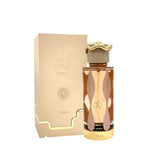 This image features a perfume bottle next to its packaging. The bottle, previously described, is accompanied by a rectangular box with a golden-beige gradient. The brand name "Lattafa" and the perfume name "TERIAQ" are embossed on the box in a stylized fo