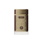 The image shows a sophisticated and elegant bottle of "Tobacco Oud" perfume by Afnan. The perfume bottle has a rectangular shape with a broad base and a short neck. It features a rich, dark brown color with golden geometric patterns that add a touch of intricate detail and luxury. The central part of the bottle has a gold label with the word "TOBACCO" prominently displayed in capital letters, followed by "Oud" in smaller font. 