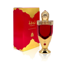 The image shows a luxurious perfume bottle next to its packaging. The bottle has a rich red color with a golden cap, detailed with intricate patterns and topped with a clear faceted finial that resembles a gem. The base and neck of the bottle also feature golden accents. A red gem is embedded in the golden section of the bottle. The packaging box is red with a golden border and carries the brand name "TOHFA" in gold lettering.