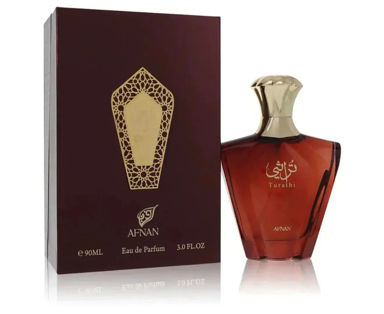 The image shows a perfume bottle next to its packaging. The box is a deep maroon with a golden geometric pattern resembling a lattice design around a central crest, and below this is the brand name "AFNAN" in gold lettering. At the bottom of the bottle, the word "AFNAN" is also visible in gold lettering. The background is white, highlighting the product, and the reflection on the surface suggests that the product is placed on a glass or glossy surface. 