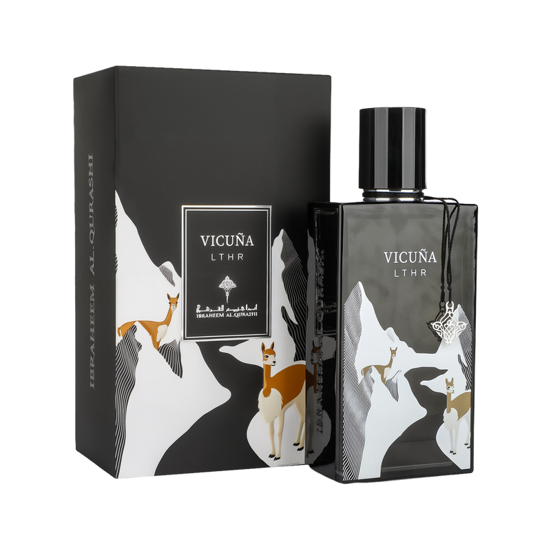 A refined bottle of Vicuña LTHR Eau De Parfum by Ibraheem Al-Qurashi, shown with its matching box. The design features a mountainous landscape in black and white with illustrated vicuñas — elegant camelids native to South America — in shades of brown and cream. The black bottle has a glossy finish, a round black cap, and is adorned with a silver ornamental charm hanging from the neck. The product name 'VICUÑA LTHR' is displayed in white on both the bottle and the box.