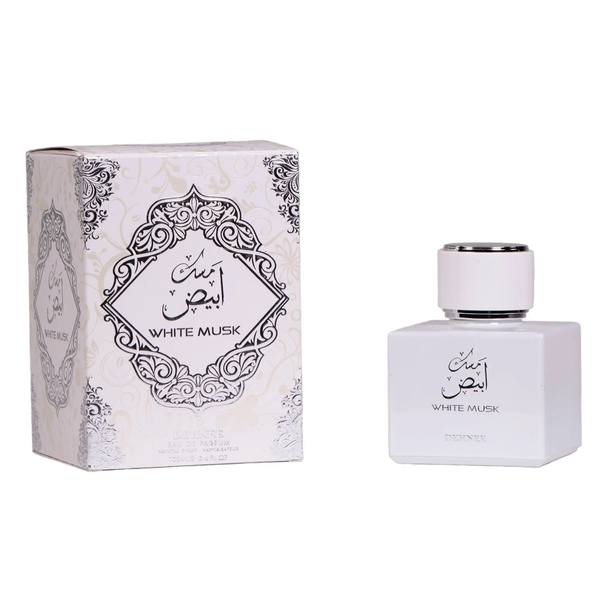 A matte white square glass perfume bottle with a silver cap, featuring a label with "WHITE MUSK" in English and Arabic script. The bottle is positioned next to its box, which carries a similar design with ornate black and grey floral patterns and the "WHITE MUSK" label within a decorative frame. The box also has the text "DEHNEE EAU DE PARFUM 100ML 3.4 FL.OZ" at the bottom.