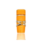 This image features a bright orange cylindrical perfume bottle with the name "YARA" from the brand Lattafa. The design is distinguished by a gold ribbon-like band wrapped around the center, with a circular emblem featuring text that may denote "EAU DE PARFUM NATURAL SPRAY". The Arabic script for "YARA" is placed above the gold band. The bottle has a glossy finish and is presented against a gradient background that fades from white at the top to a light reflection of the bottle at the base.