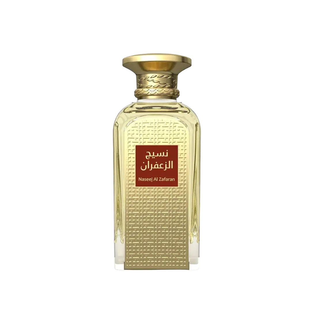 The image depicts a rectangular glass perfume bottle with a luxurious gold cap. The bottle features a textured surface with a pattern of small, uniform, square indentations. A red label with Arabic script and the English transliteration "Naseej Al Zafran" is prominently displayed on the front, indicating the fragrance's name or the brand. The design suggests opulence and sophistication, typical of a premium fragrance product.