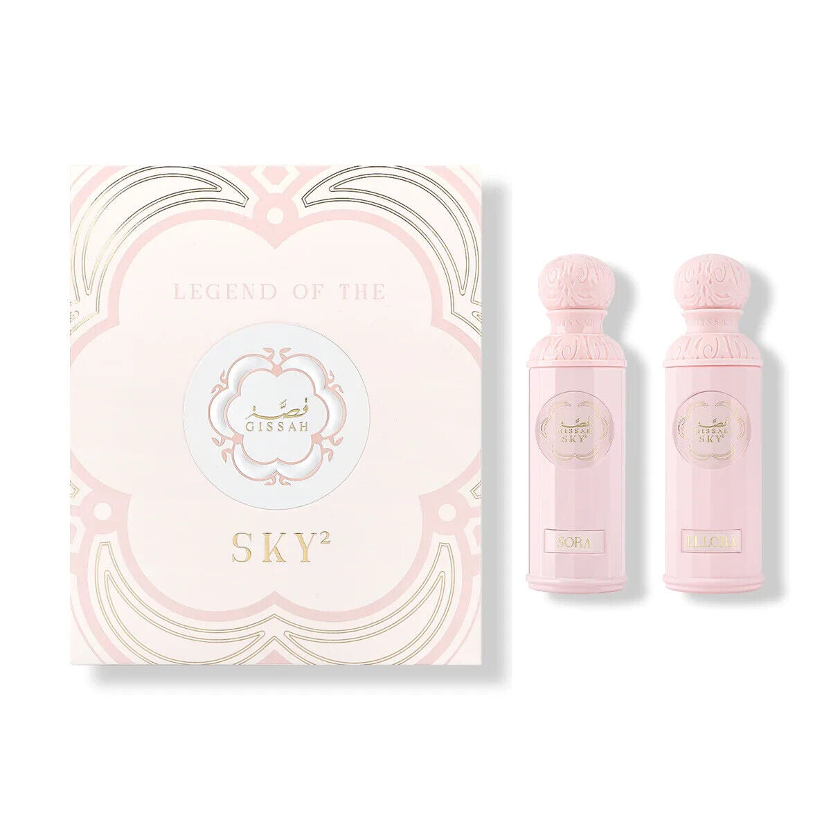 The image showcases the "Legend of the Sky²" perfume set for her by Gissah, with two bottles named "Sora" and "Ellora." The set is presented in front of a pastel pink box with a delicate gold and white design. The box has the collection name and the Gissah logo printed in the center. The perfume bottles are a soft pink color with ornate silver caps and central medallions that contain the name "Gissah Sky." The bottles' designs are elegant and feminine.
