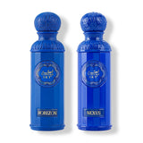 The image displays two perfume bottles from the "Legend of the Sky" collection by Gissah, named "Horizon" and "Nexus." Both bottles are vibrant blue with a tall, cylindrical shape and an ornate, embossed cap. The front of each bottle features an ornamental gold emblem with the collection's name, "GISSAH SKY," and each has a gold label with the individual fragrance's name. 