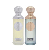 The image features two perfume bottles from the Gissah collection, "Hudson II" and "Imperial II." Both bottles have tall, cylindrical shapes with ornate silver caps featuring embossed designs. "Hudson II" has a light yellow tinted glass body with a silver medallion, and "Imperial II" has a light blue tinted glass body with a copper medallion. Each bottle is labeled with its respective name in elegant font at the bottom. 